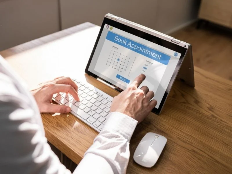 Person booking an appointment on a tablet