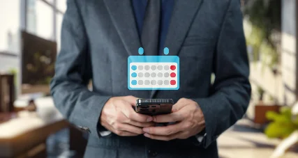 Person holding a smartphone showing an appointment calendar